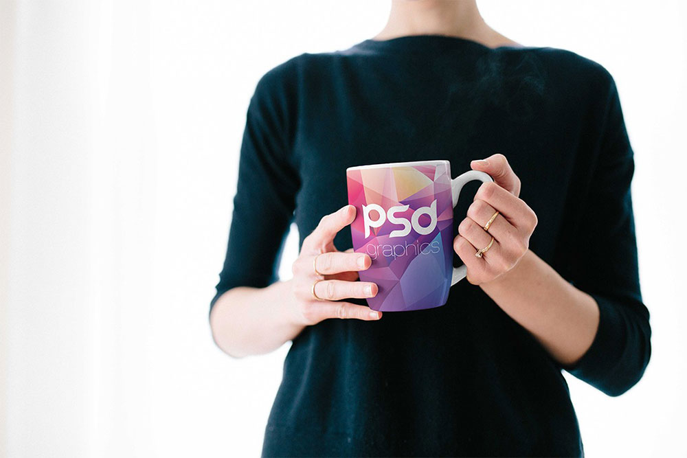 Free Woman Holding Coffee Mug Mockup