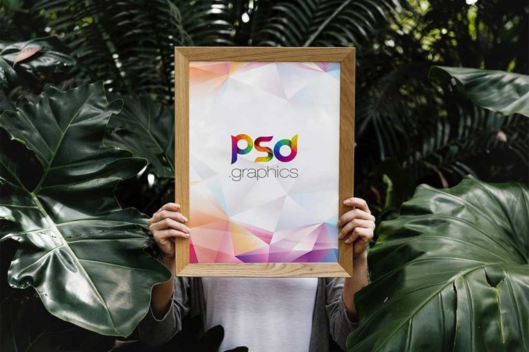 Free Holding Poster Frame Mockup | Mockuptree
