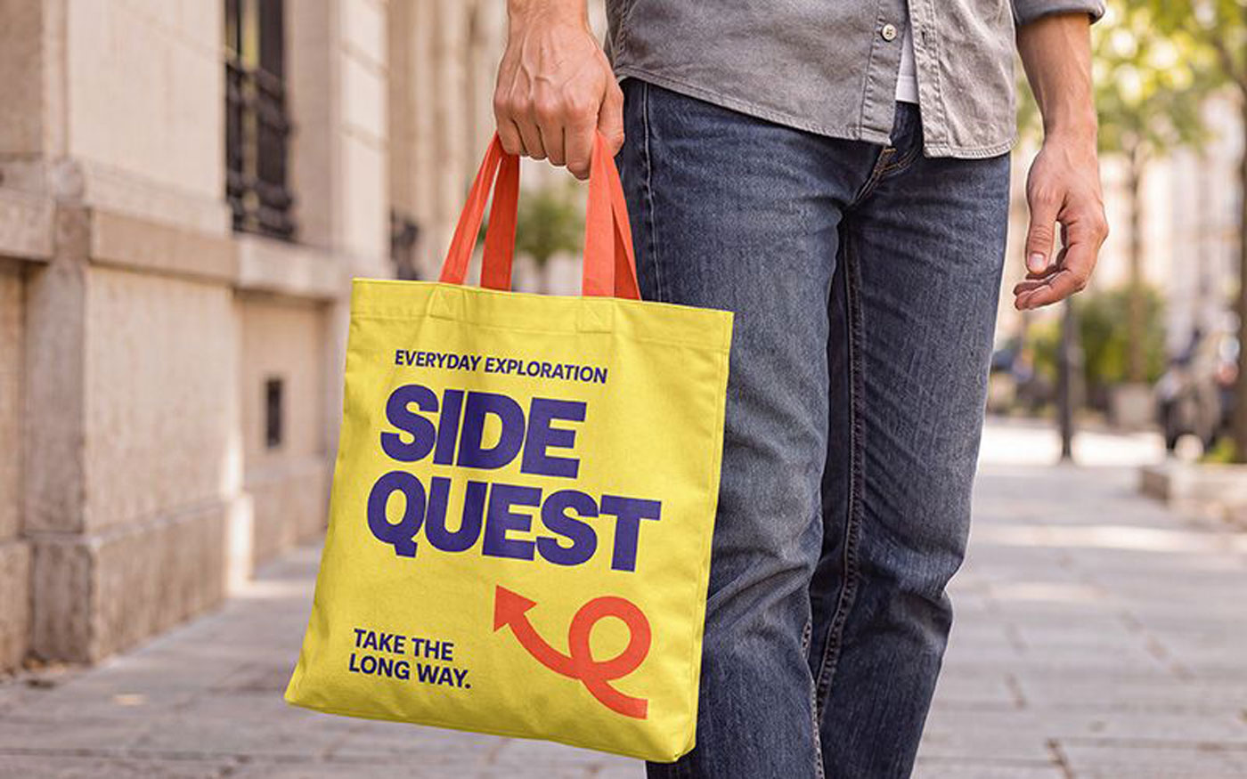 Free Hand Holding Canvas Tote Bag Mockup